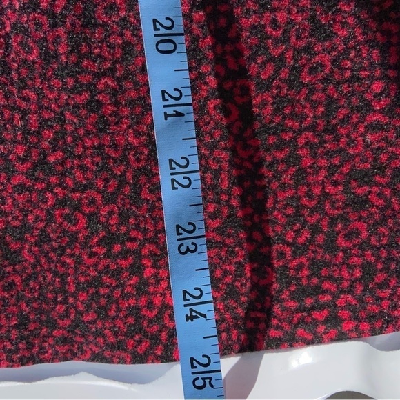 It’s red and black top has a Lovely lace V-neck with a little red bow. So soft! - Picture 4 of 5